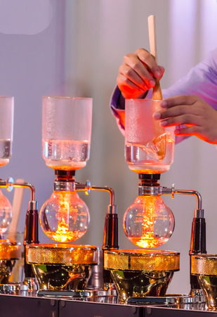 Syphon Coffee or Vacuum Coffee is full immersion tasteful, Blended smell and taste of roasted coffee with direct contact boiled water and show boiling water, stunning vacuum process by Beam heater.の写真素材