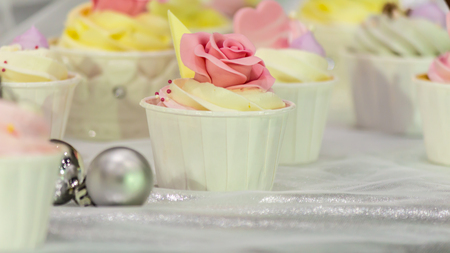 Cupcakes on tier at wedding reception.の写真素材