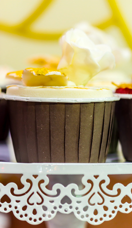 Cupcakes on tier at wedding reception.の写真素材