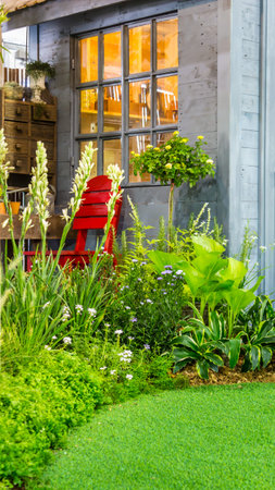 Relaxing area with red chair in cozy garden.