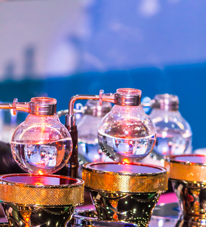 Syphon Coffee or Vacuum Coffee is full immersion tasteful, Blended smell and taste of roasted coffee with direct contact boiled water and show boiling water, stunning vacuum process by Beam heater.の写真素材