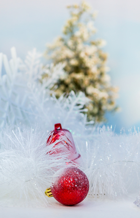 Every december cool and white christmas tree decoration with colourful bauble, mask, snow man, giftbox.の写真素材