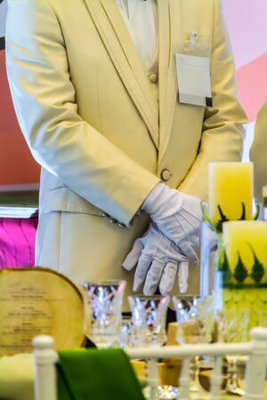 Waiter ready to service at Luxury party dinner in restaurant.の写真素材