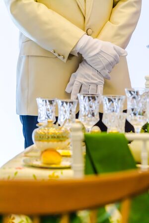 Waiter ready to service at Luxury party dinner in restaurant.の写真素材