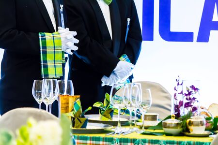 Waiter ready to service at Luxury party dinner in restaurant.の写真素材