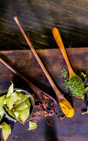 Top view Thai spices and herbs ingredient decoration on wood table for cook in home kitchen.の写真素材