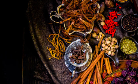 Top view Thai spices and herbs ingredient decoration on wood table for cook in home kitchen.