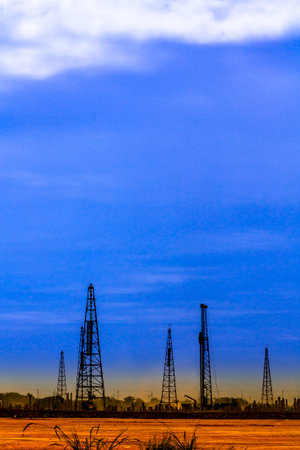 pile crane driving concrete piles in factory foundation construction building site.