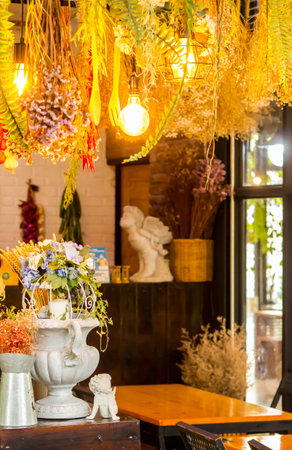 Flower pot style Gothic on table with dry flower bouquet decoration in old kitchen.
