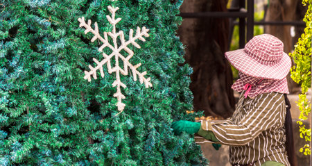 Worker decoration christmas ornament on Christmas tree.の写真素材