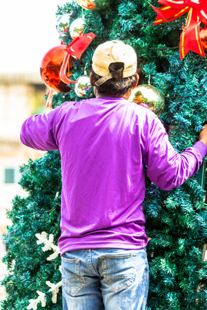 Worker decoration christmas ornament on Christmas tree.の写真素材