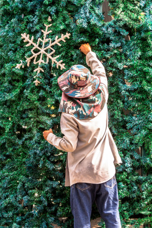 Worker decoration christmas ornament on Christmas tree.の写真素材