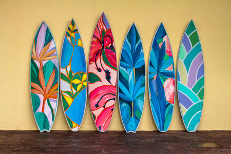 Flashy pattern surfboard against the rock wall.