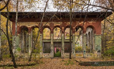 Facade of old abandoned ruins in the forestの写真素材