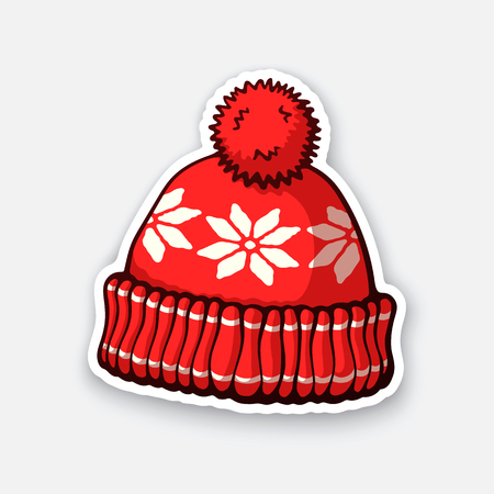 Vector illustration. Red winter hat with pompon and snowflake pattern. Christmas headdress made of wool for cold weather. Sticker in cartoon style with contour. Isolated on white backgroundのイラスト素材