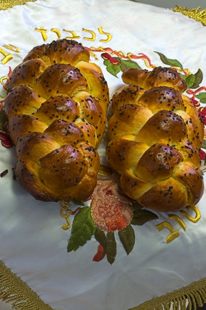 Fresh backed challahs cooling on Shabbos bread-cover