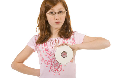 Girl holding blank digital media diskの写真素材