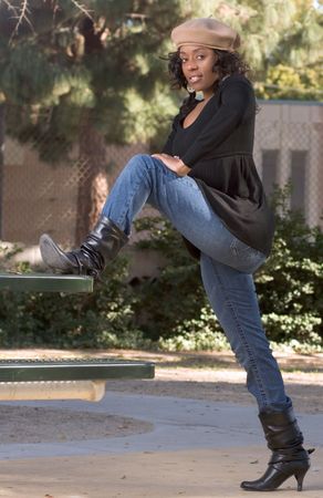 Portrait of African-American girl  in jeans and bootsの写真素材