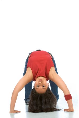 Break dancing girl in bridge pose (front view)の写真素材