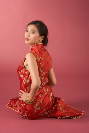 Portrait of young beautiful Chinese female in traditional clothes (cheongsam)の写真素材