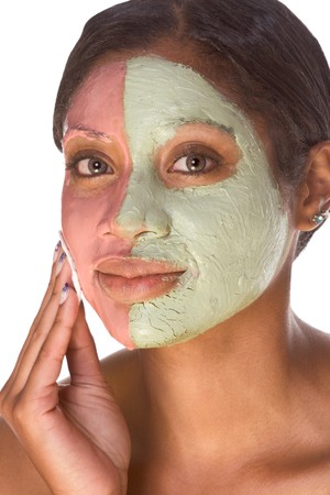 Woman with special facial mask applied on her face. The mask consist of two colors (red and green), each cover different part の写真素材