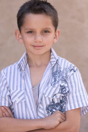 Headshot of elementary age kid in short sleeve shirt. Multi-ethnic of Caucasian and Hispanic (Mexican) mix の写真素材