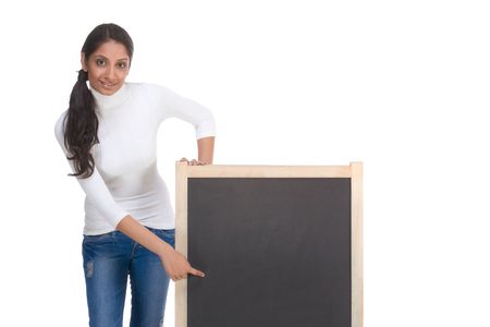 Friendly Indian college student woman by chalkboardの写真素材