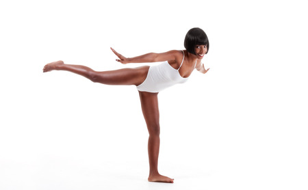 black ethnic African-American gymnastics ballet dancer woman in white one piece leotardの写真素材