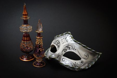Two Venetian Glass jugs and a Venetian mask on black backgroundの写真素材