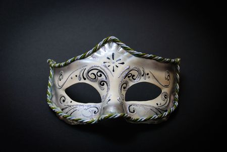 A white Venetian Mask on black backgroundの写真素材