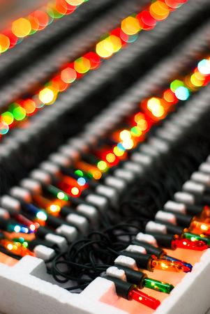 Decorative lights normally used for Christmas trees still in their styrofoam box.の写真素材