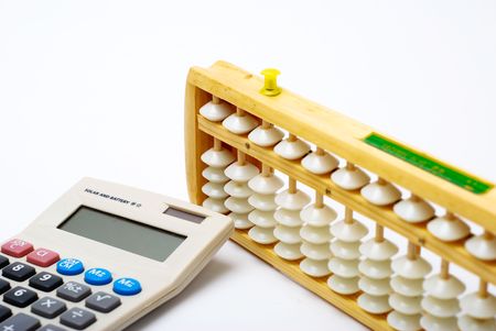 Traditional abacus and modern calculatorの写真素材