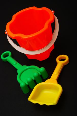 Plastic beach toys on black backgroundの写真素材