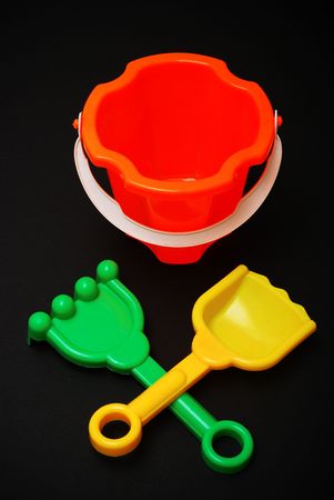 Plastic beach toys on black backgroundの写真素材