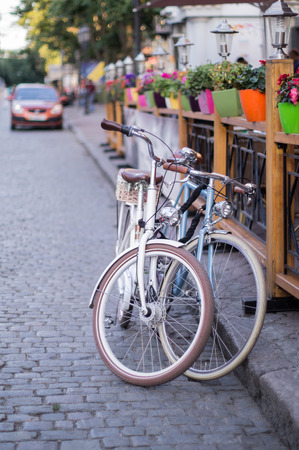 Two bicycles near a street cafe.の写真素材