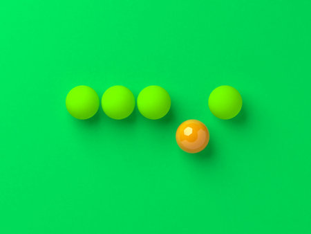 Unique single orange ball among the green balls concept illustration.