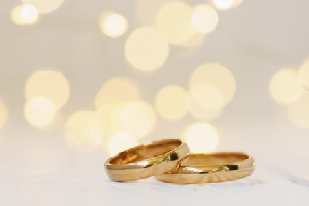 Wedding background with two golden rings with copy space.