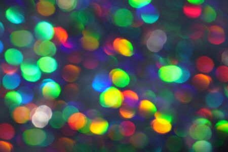 Abstract holographic iridescent gradient color background with numerous colourful bright festive glitter.の写真素材