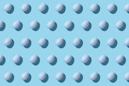 Easter egg patern in blue. Happy Easter. Minimal concept. Flat lay. Top view.の写真素材