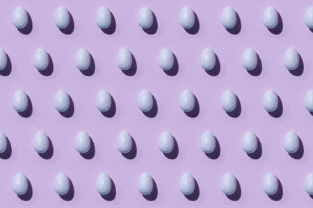 Easter egg pattern in violet or light purple. Happy Easter. Minimal concept. Flat lay. Top view.の写真素材
