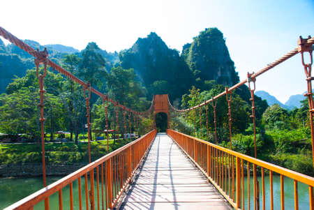 Orange bridge over song river in Vang Vieng,Laosの写真素材