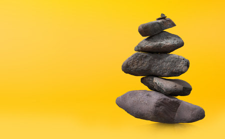 Balance Stones to pyramid in the sunset background.の写真素材