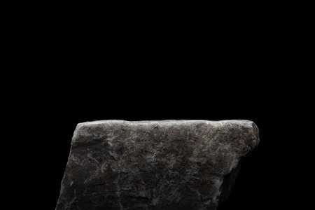 Stone podium on dark black background.の写真素材