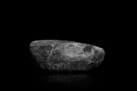 Stone podium on dark black background.の写真素材