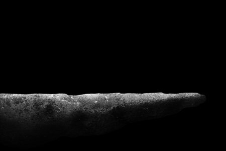 Stone podium on dark black background.の写真素材