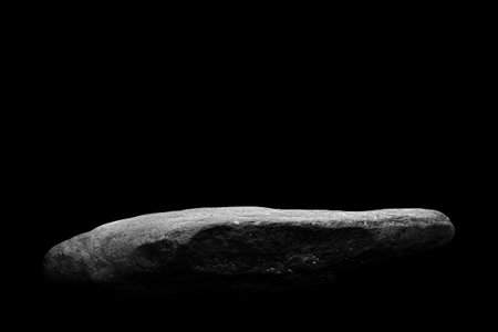 Stone podium on dark black background.の写真素材