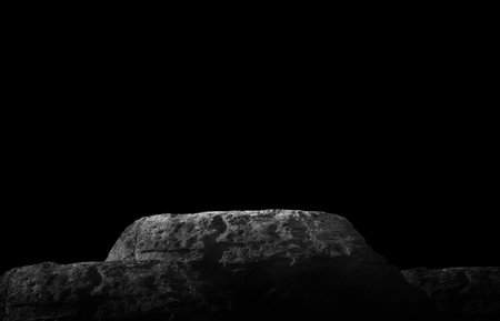 Stone podium on dark black background.の写真素材