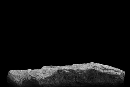 Stone podium on dark black background.の写真素材