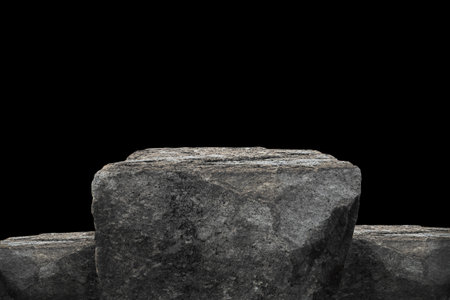 Stone podium on dark black background.の写真素材