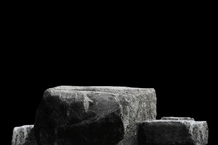 Stone podium on dark black background.の写真素材